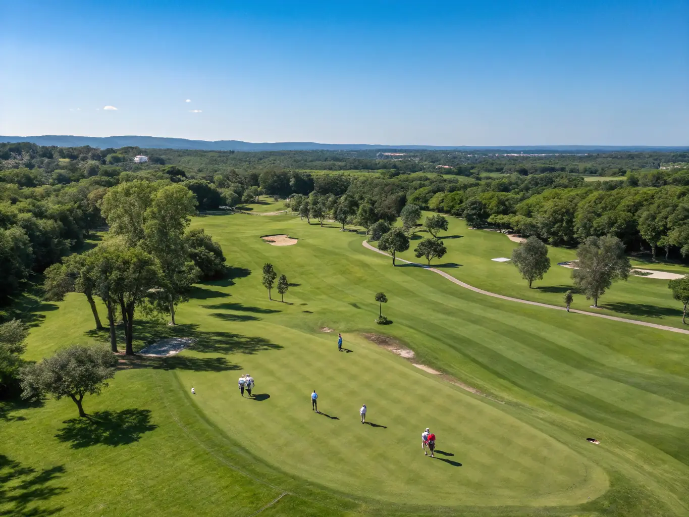 A vibrant image of the London Golf Club’s championship course, with manicured fairways, rolling hills, and golfers enjoying a sunny day, set against the backdrop of the Kent countryside for a luxury retreat website.